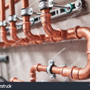 stock-photo-plumbing-service-copper-pipeline-of-a-heating-system-in-boiler-room-1614456811